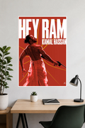 Image 2 (Desk Mockup View): Hey Ram Kamal Haasan wall poster hung above a modern wooden study desk and desk lamp.