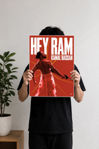 Image 1 (Handheld View): Person holding a red Hey Ram Kamal Haasan minimalist movie art poster print.