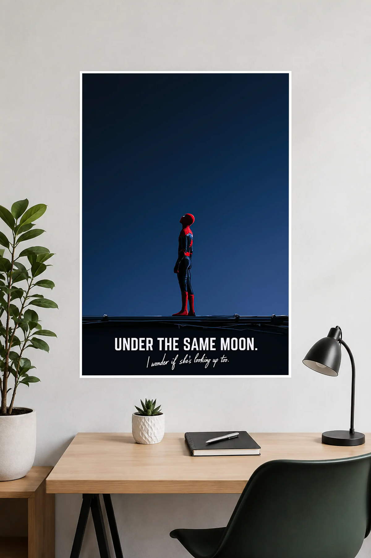 Image 1 (Handheld View): Person holding a minimalist Spider-Man "Under The Same Moon" quote art poster with a deep navy night sky.