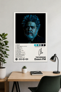The Weeknd Dawn FM album cover poster hanging on a modern office wall above a wooden desk with minimalist decor